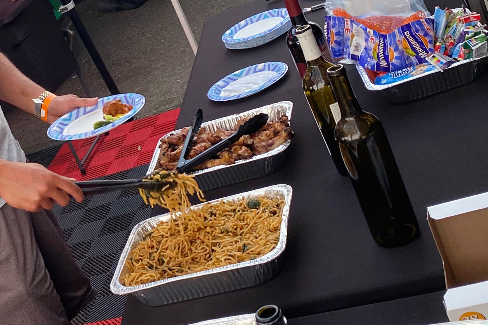 Hospitality setup at the track with catering. Crew and clients enjoying lunch at the track.